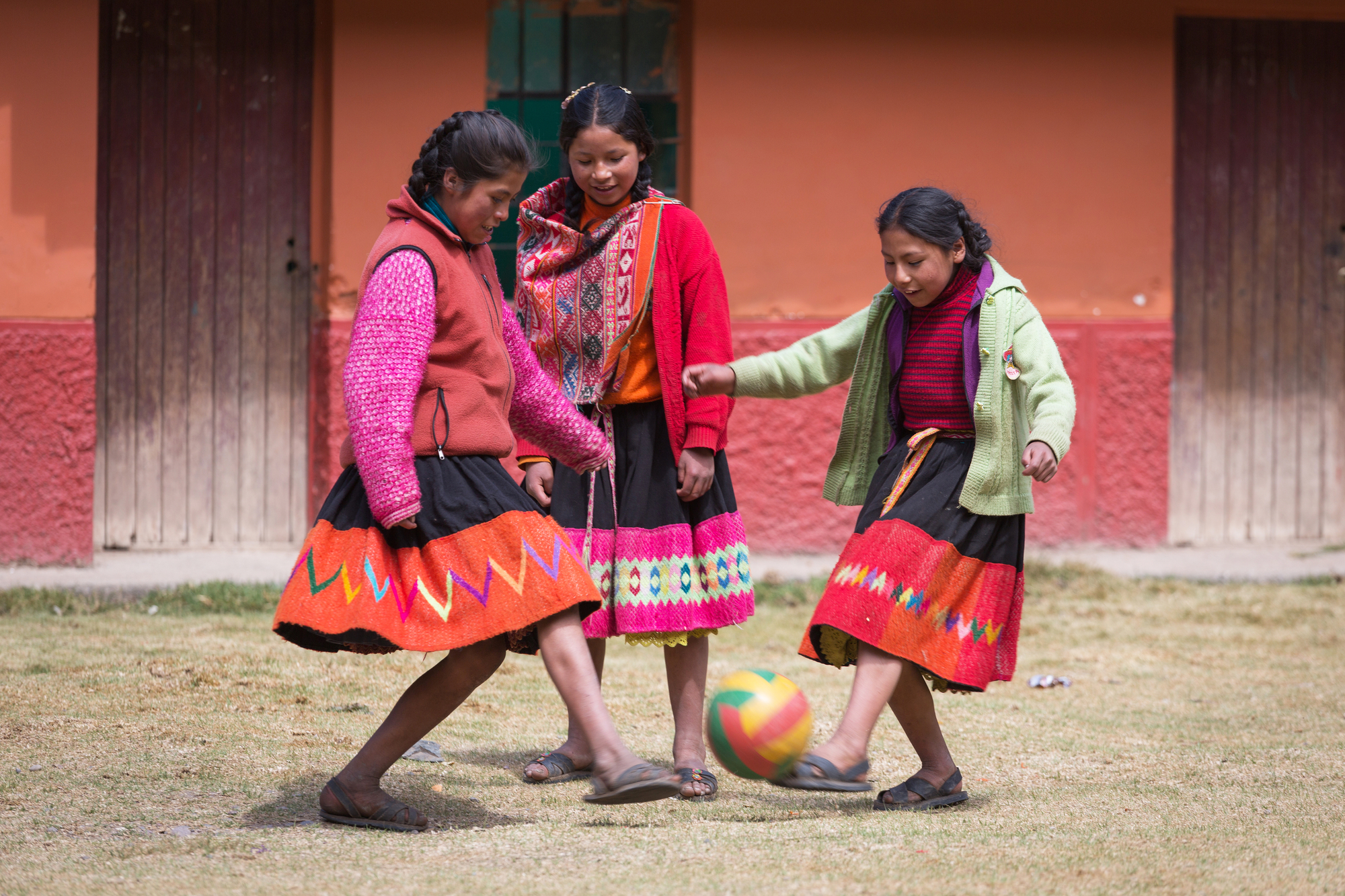  happy girls playing soccer
